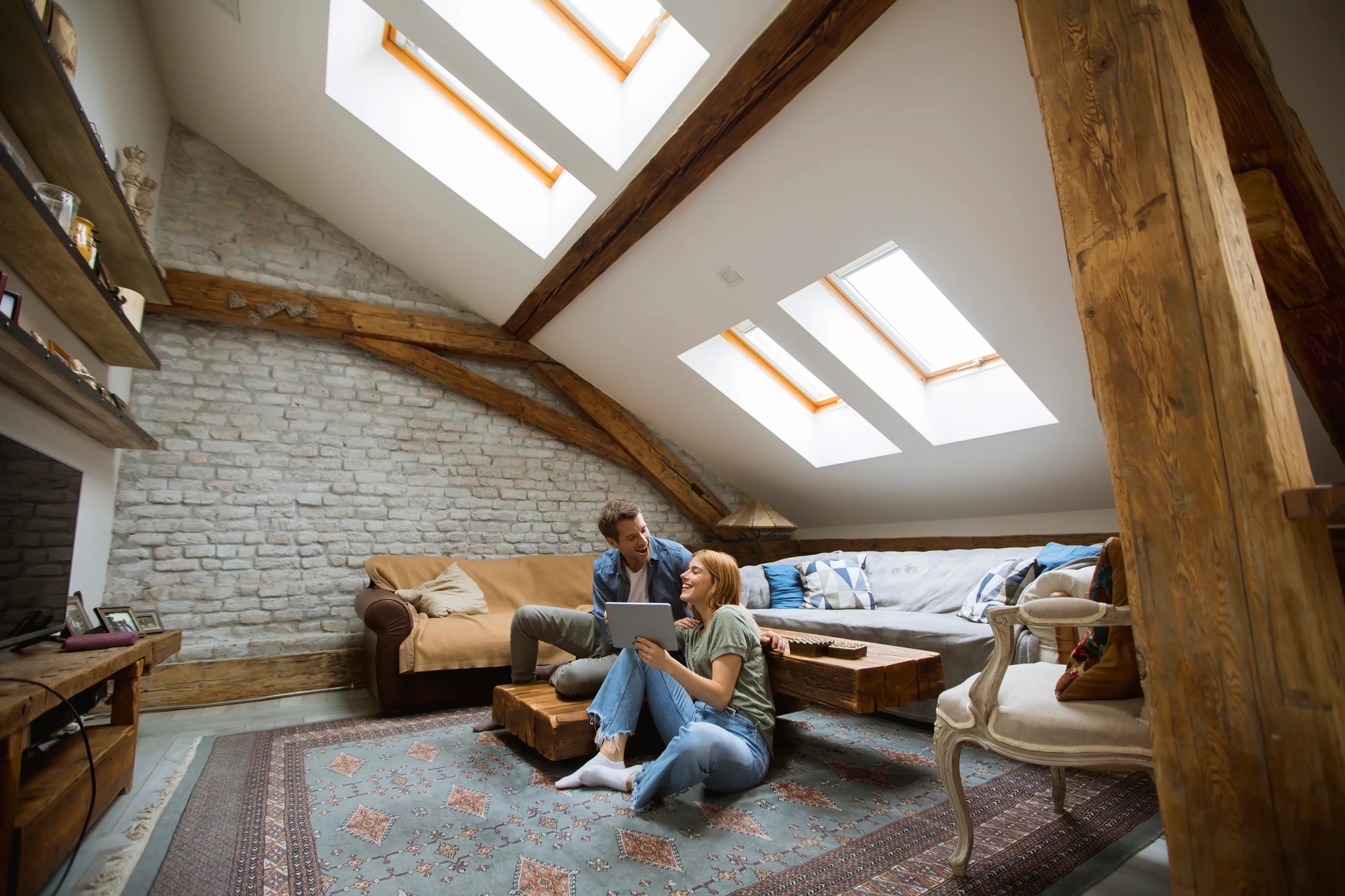 Lofts and Retrofits - young-couple-using-tablet-sitting-on-the-floor-at-2025-02-22-16-49-34-utc